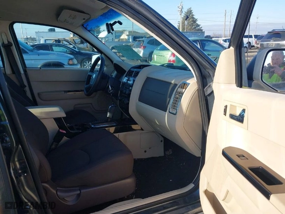 2008 Mazda Tribute Touring with VIN 4F2CZ96168KM05738, listed as a IAAI auction lot 41403675 with 217,593 mi miles. Bid and sale history available at carsss.com. Image 5.