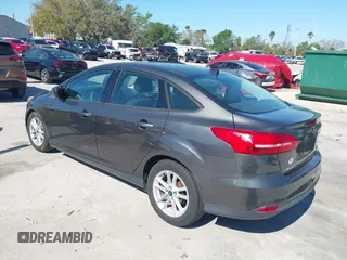 2018 Ford Focus SE z VIN 1FADP3F27JL245603, wystawiony jako IAAI lot #41773395 z przebiegiem 94 044 mil mil oraz . Historia ofert i sprzedaży dostępna na DreamBid. Obrazek 3.