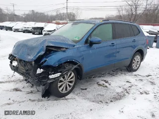 2018 Volkswagen Tiguan S with VIN 3VV0B7AX8JM081263, listed as a IAAI auction lot 41245308 with 58,778 mi miles. Bid and sale history available at carsss.com. Image 2.