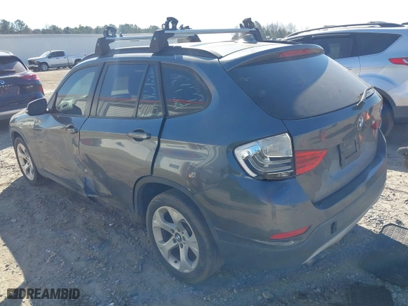 2014 BMW X1 sDrive28i with VIN WBAVM1C57EVW52502, listed as a IAAI auction lot 41702746 with 165,089 mi miles. Bid and sale history available at carsss.com. Image 3.