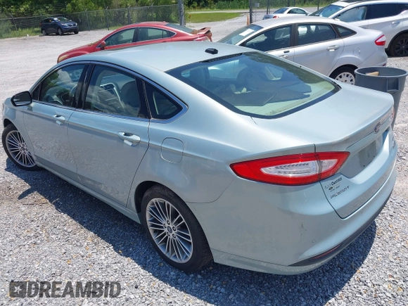 2013 Ford Fusion SE Hybrid z VIN 3FA6P0LU4DR259073, wystawiony jako IAAI lot #42197143 z przebiegiem 87 337 mil mil oraz . Historia ofert i sprzedaży dostępna na DreamBid. Obrazek 3.