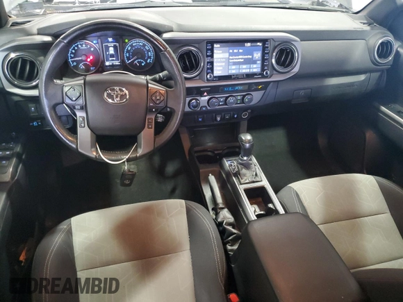 2021 Toyota Tacoma SR with VIN 3TMCZ5ANXMM425903, listed as a Copart auction lot 57963425 with 61,458 mi miles and Salvage title. Bid and sale history available at DreamBid. Image 8.
