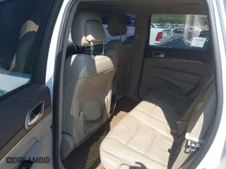 2014 Jeep Grand Cherokee Overland with VIN 1C4RJFCTXEC128443, listed as a IAAI auction lot 40512681 with 126,379 mi miles. Bid and sale history available at carsss.com. Image 8.