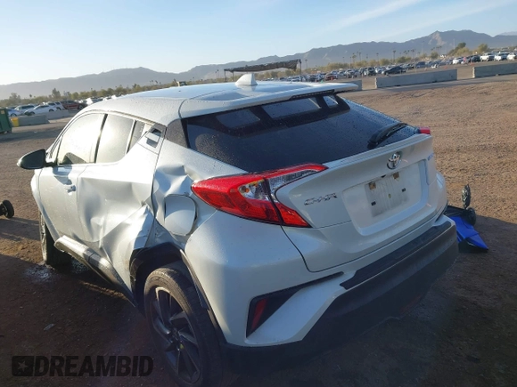 2021 Toyota C-HR LE with VIN JTNKHMBX3M1114590, listed as a IAAI auction lot 41560459 with 61,803 mi miles. Bid and sale history available at carsss.com. Image 3.