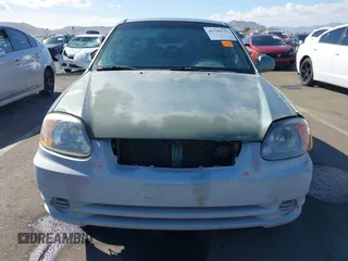 2005 Hyundai Accent GLS with VIN KMHCG45C95U620716, listed as a IAAI auction lot 41740573 with 187,971 mi miles. Bid and sale history available at carsss.com. Image 13.