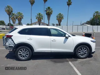 2019 Mazda CX-9 Touring with VIN JM3TCACY8K0300956, listed as a IAAI auction lot 42493003 with 123,709 mi miles and . Bid and sale history available at DreamBid. Image 14.