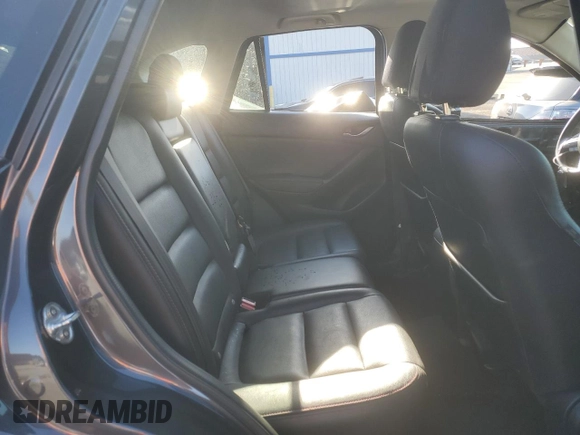 2014 Mazda CX-5 Grand Touring with VIN JM3KE4DY1E0328852, listed as a Copart auction lot 53965265 with 67,242 mi miles and Salvage Title. Bid and sale history available at DreamBid. Image 11.