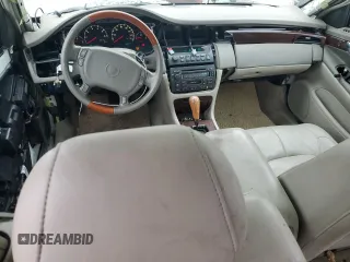 2000 Cadillac DeVille DTS z VIN 1G6KF5797YU263599, wystawiony jako Copart lot #81576484 z przebiegiem 118 414 mil mil oraz Szkoda całkowita • Salvage title. Historia ofert i sprzedaży dostępna na DreamBid. Obrazek 8.