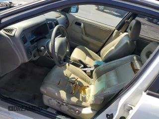 2002 Infiniti G20 Luxury z VIN JNKCP11A52T509667, wystawiony jako Copart lot #72986584 z przebiegiem 119 458 mil mil oraz Szkody całkowita. Historia ofert i sprzedaży dostępna na DreamBid. Obrazek 7.