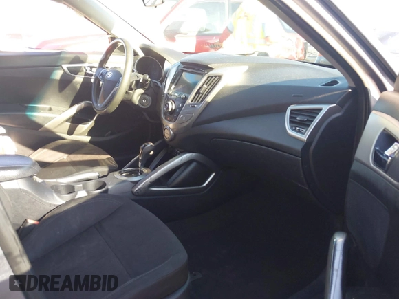 2016 Hyundai Veloster with VIN KMHTC6AD3GU283985, listed as a IAAI auction lot 41872103 with 153,949 mi miles. Bid and sale history available at carsss.com. Image 5.