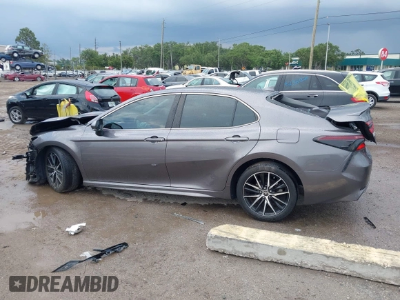 2023 Toyota Camry SE z VIN 4T1T11AK8PU802097, wystawiony jako IAAI lot #42389754 z przebiegiem 19 732 mil mil oraz . Historia ofert i sprzedaży dostępna na DreamBid. Obrazek 14.