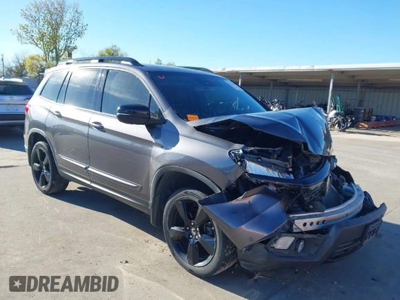 2019 Honda Passport Elite z VIN 5FNYF8H07KB015720, wystawiony jako IAAI lot #41221298 z przebiegiem 65 747 mil mil oraz . Historia ofert i sprzedaży dostępna na DreamBid. Obrazek 1.