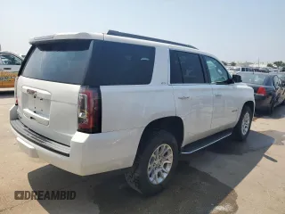 2020 GMC Yukon SLT with VIN 1GKS1BKC0LR243224, listed as a Copart auction lot 65768234 with 129,702 mi miles and Salvage Title. Bid and sale history available at DreamBid. Image 3.