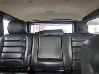 2006 Hummer H2 z VIN 5GRGN23U66H116855, wystawiony jako Copart lot #56010175 z przebiegiem 217 798 mil mil oraz Tytuł czysty. Historia ofert i sprzedaży dostępna na DreamBid. Obrazek 10.
