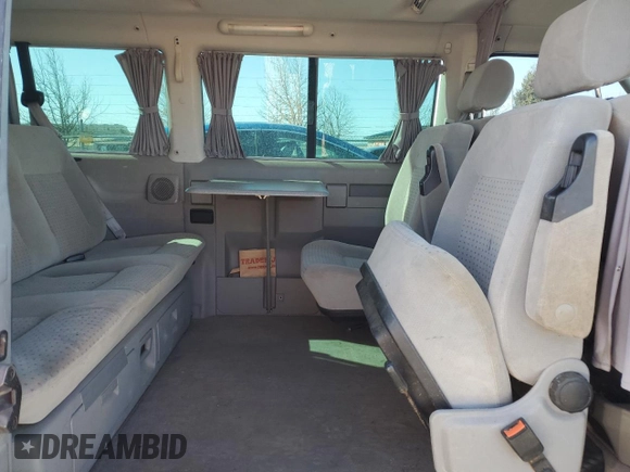 2001 Volkswagen EuroVan MV с VIN WV2MB47071H128880, выставлен на аукционе Copart как лот 48175195 с пробегом 182 488 миль миль и Чистый • Clean title. История ставок и продаж доступна на DreamBid. Изображение 11.