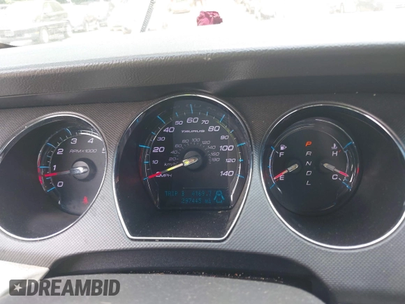 2011 Ford Taurus SE with VIN 1FAHP2DW9BG179423, listed as a IAAI auction lot 39683731 with 297,445 mi miles. Bid and sale history available at carsss.com. Image 7.