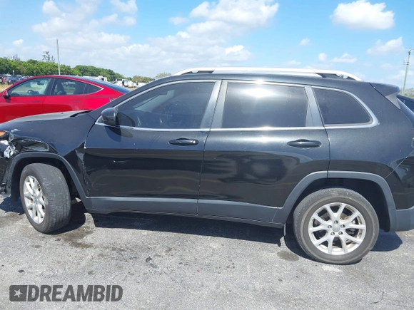 2015 Jeep Cherokee Latitude with VIN 1C4PJLCB4FW683904, listed as a IAAI auction lot 41579059 with 126,156 mi miles and . Bid and sale history available at carsss.com. Image 14.