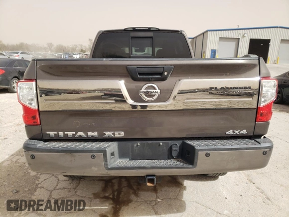 2016 Nissan Titan Pro-4X z VIN 1N6BA1F4XGN502773, wystawiony jako Copart lot #49285535 z przebiegiem 129 390 mil mil oraz Czysty tytuł • Clean title. Historia ofert i sprzedaży dostępna na DreamBid. Obrazek 6.
