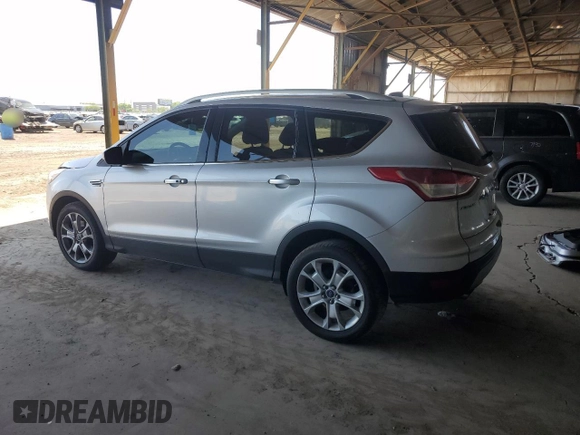 2015 Ford Escape Titanium with VIN 1FMCU9J96FUB33670, listed as a Copart auction lot 61826915 with 179,794 mi miles and Salvage title. Bid and sale history available at DreamBid. Image 2.