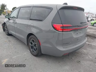 2023 Chrysler Pacifica Hybrid Touring L with VIN 2C4RC1L71PR584485, listed as a IAAI auction lot 42056423 with 58,955 mi miles and . Bid and sale history available at DreamBid. Image 3.