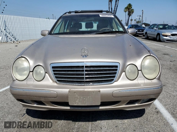 2000 Mercedes-Benz E-Class AWD with VIN WDBJH82J8YX042547, listed as a Copart auction lot 58063494 with 138,392 mi miles and Salvage Title. Bid and sale history available at carsss.com. Image 5.