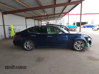 2015 Infiniti Q70 z VIN JN1BY1AP9FM542429, wystawiony jako IAAI lot #41903214 z przebiegiem 139 255 mil mil oraz . Historia ofert i sprzedaży dostępna na DreamBid. Obrazek 13.