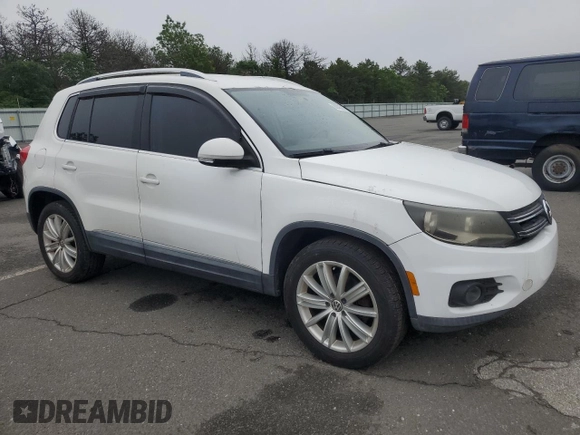 2013 Volkswagen Tiguan SE with VIN WVGAV3AX1DW574009, listed as a Copart auction lot 60936735 with 121,624 mi miles and Clean title. Bid and sale history available at DreamBid. Image 4.
