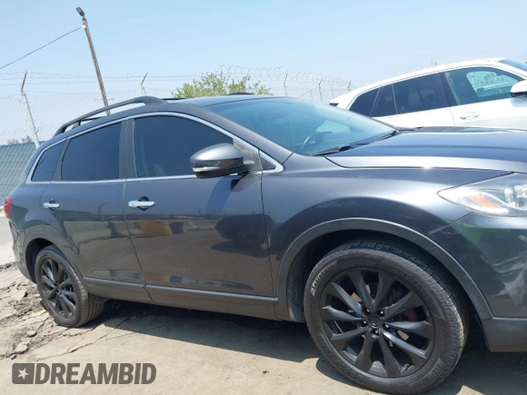 2015 Mazda CX-9 Grand Touring with VIN JM3TB3DA0F0459024, listed as a IAAI auction lot 42452288 with 174,716 mi miles and . Bid and sale history available at DreamBid. Image 13.