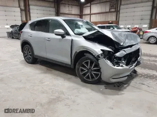 2018 Mazda CX-5 Grand Touring with VIN JM3KFBDM2J0314287, listed as a IAAI auction lot 41929042 with 75,203 mi miles. Bid and sale history available at carsss.com. Image 1.