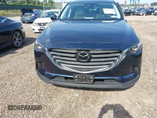 2021 Mazda CX-9 Touring with VIN JM3TCBCY7M0507699, listed as a IAAI auction lot 42603614 with 62,635 mi miles and . Bid and sale history available at DreamBid. Image 12.