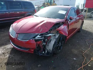 2015 Lincoln MKZ z VIN 3LN6L2G94FR619447, wystawiony jako IAAI lot #41831679 z przebiegiem 97 906 mil mil oraz . Historia ofert i sprzedaży dostępna na DreamBid. Obrazek 2.