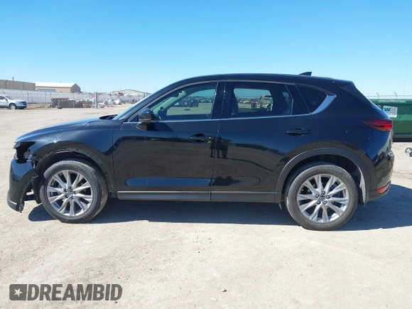 2020 Mazda CX-5 Grand Touring with VIN JM3KFBDMXL0763316, listed as a IAAI auction lot 41661958 with 64,881 mi miles and . Bid and sale history available at carsss.com. Image 15.