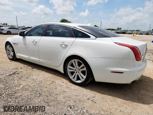 2015 Jaguar XJ Portfolio with VIN SAJWA2GZ7F8V82990, listed as a Copart auction lot 63325535 with 113,892 mi miles and Salvage title. Bid and sale history available at DreamBid. Image 2.
