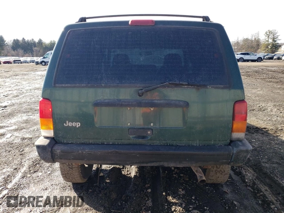 1999 Jeep Cherokee SE with VIN 1J4FF28S3XL551875, listed as a Copart auction lot 43057555 with 226,794 mi miles and Salvage title. Bid and sale history available at DreamBid. Image 6.