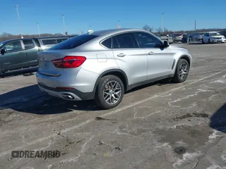 2018 BMW X6 xDrive35i with VIN 5UXKU2C50J0X51275, listed as a IAAI auction lot 41421704 with 165,052 mi miles. Bid and sale history available at carsss.com. Image 4.