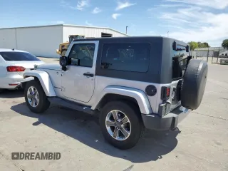2009 Jeep Wrangler Sahara with VIN 1J4FA54149L708183, listed as a Copart auction lot 65989125 with 133,436 mi miles and Salvage title. Bid and sale history available at DreamBid. Image 2.