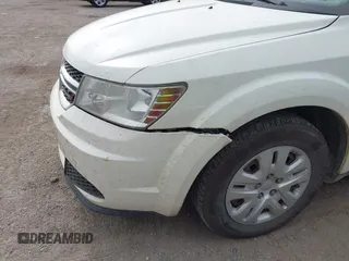 2013 Dodge Journey American Value with VIN 3C4PDCAB2DT675622, listed as a IAAI auction lot 42626554 with 103,169 mi miles and . Bid and sale history available at DreamBid. Image 13.