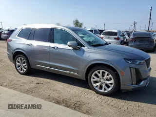 2020 Cadillac XT6 FWD Premium Luxury with VIN 1GYKPCRS5LZ201302, listed as a Copart auction lot 55103225 with 61,527 mi miles and Salvage Title. Bid and sale history available at carsss.com. Image 4.