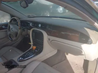 2004 Jaguar XJ with VIN SAJWA71C74SG22814, listed as a IAAI auction lot 41649399 with 114,841 mi miles. Bid and sale history available at carsss.com. Image 5.