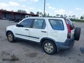2005 Honda CR-V LX with VIN JHLRD68565C005484, listed as a IAAI auction lot 41983513 with 215,839 mi miles. Bid and sale history available at carsss.com. Image 3.