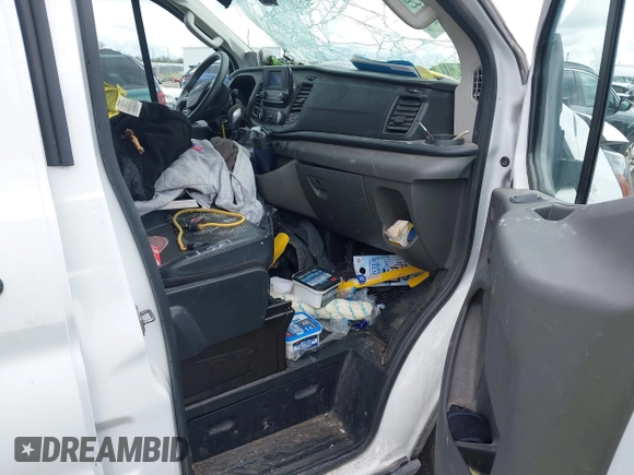 2021 Ford Transit Cargo z VIN 1FTYE1Y86MKA71783, wystawiony jako IAAI lot #42183454 z przebiegiem 53 405 mil mil oraz . Historia ofert i sprzedaży dostępna na DreamBid. Obrazek 5.