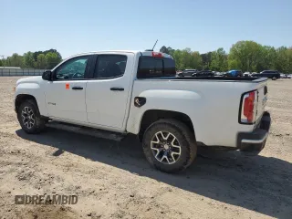 2021 GMC Canyon 4WD AT4 z VIN 1GTG6FEN5M1118081, wystawiony jako Copart lot #52452785 z przebiegiem 92 960 mil mil oraz Szkody całkowita. Historia ofert i sprzedaży dostępna na DreamBid. Obrazek 2.