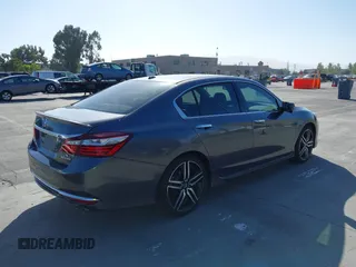 2017 Honda Accord Touring with VIN 1HGCR3F97HA030310, listed as a IAAI auction lot 42539852 with 64,849 mi miles and . Bid and sale history available at DreamBid. Image 4.