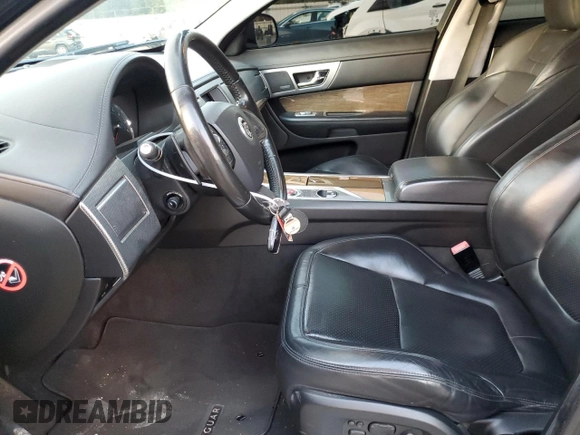 2013 Jaguar XF with VIN SAJWA0JC4DMS64094, listed as a Copart auction lot 80721014 with 133,462 mi miles and Salvage Title. Bid and sale history available at DreamBid. Image 7.