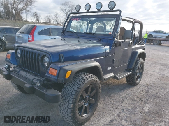 2001 Jeep Wrangler Sport with VIN 1J4FA49S41P334053, listed as a IAAI auction lot 41884967 with 158,258 mi miles. Bid and sale history available at carsss.com. Image 2.