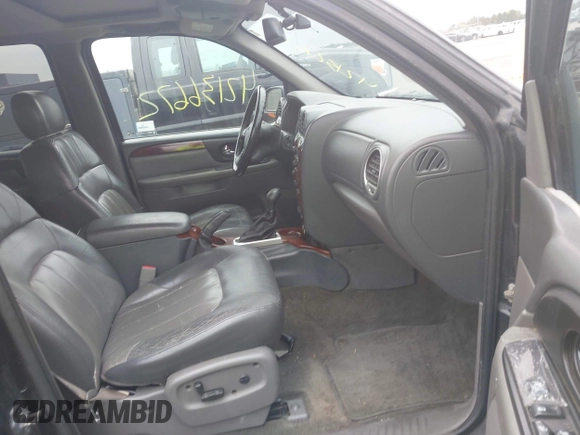 2002 GMC Envoy SLT with VIN 1GKDT13S222143135, listed as a IAAI auction lot 42136672 with 206,064 mi miles. Bid and sale history available at carsss.com. Image 5.