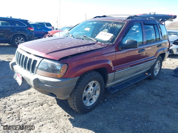 1999 Jeep Grand Cherokee Laredo with VIN 1J4GW58S5XC781472, listed as a IAAI auction lot 41738515 with 216,000 mi miles. Bid and sale history available at carsss.com. Image 2.