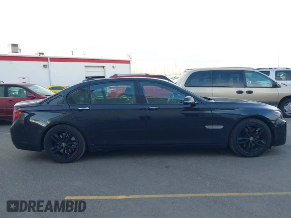 2015 BMW 7 Series 750Li xDrive with VIN WBAYF8C55FD654949, listed as a IAAI auction lot 41659763 with 91,837 mi miles and . Bid and sale history available at carsss.com. Image 13.