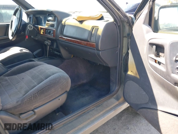1996 Jeep Grand Cherokee Laredo with VIN 1J4GZ58S7TC280276, listed as a IAAI auction lot 42120454 with 230,617 mi miles. Bid and sale history available at carsss.com. Image 5.