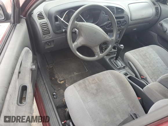 1997 Mitsubishi Mirage DE z VIN JA3AY26AXVU007285, wystawiony jako Copart lot #71958454 z przebiegiem 156 415 mil mil oraz Szkoda całkowita • Salvage title. Historia ofert i sprzedaży dostępna na DreamBid. Obrazek 8.